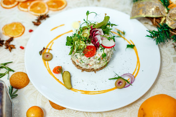 French salad Olivier served on the table