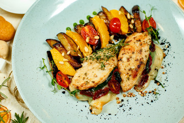 chicken breast with mashed potatoes and grilled vegetables and ingredients served on the table