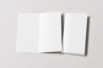 Blank square leaflet on white wooden background. Bi-fold or half-fold opened and folded brochure isolated with clipping path. Side view. 3d illustration