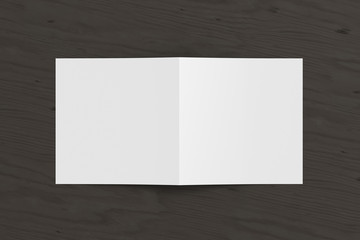 Blank square pages leaflet cover on black wooden background. Bi-fold or half-fold opened brochure isolated with clipping path. View directly above. 3d illustration