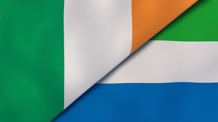 The flags of Ireland and Sierra Leone. News, reportage, business background. 3d illustration