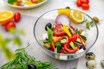 fresh vegetarian salad with greens and vegetables on the table, healthy food
