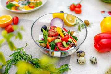 fresh vegetarian salad with greens and vegetables on the table, healthy food