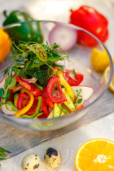fresh vegetarian salad with greens and vegetables on the table, healthy food