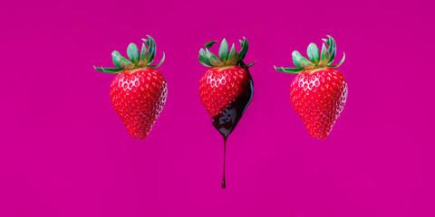 Strawberry photography session with solid purple pink background