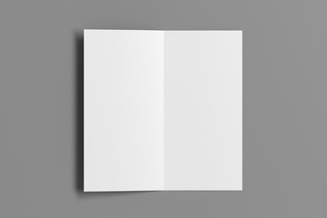 Blank square leaflet on gray background. Bi-fold or half-fold opened brochure isolated with clipping path. View directly above. 3d illustration