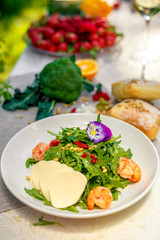 fresh salad with dried meat greens and vegetables on the table, healthy food