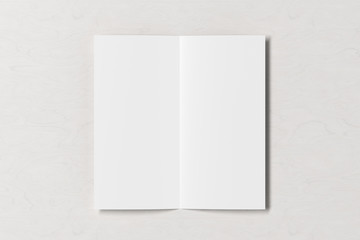 Blank square leaflet on white wooden background. Bi-fold or half-fold opened brochure isolated with clipping path. View directly above. 3d illustration