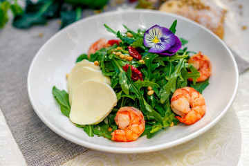 fresh salad with dried meat greens and vegetables on the table, healthy food