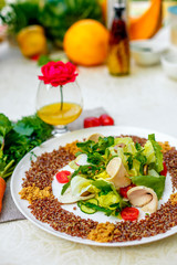 salad with red quinoa and chicken breast with tomatoes served on the table with ingredients, healthy food