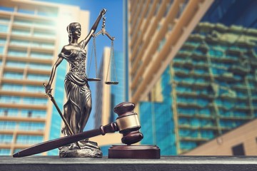 Lady Themis with scales of justice and wooden gavel