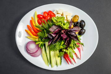 vegetable slices, cheese, tomatoes, peppers, greens, radishes, onions, cucumbersand olives, healthy food, isolated