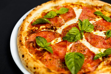 hot italian pizza with cheese and basil, isolated