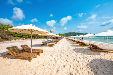 Row of Colorful Sunbathing Chairs on the Sao Beach of Phu Quoc Island, Vietnam, a Tourism Destination for Summer Vacation in Southeast Asia, with Tropical Climate and Beautiful Landscape.