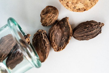 Black cardamom spread from jar to table