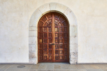 Old wooden door and arch