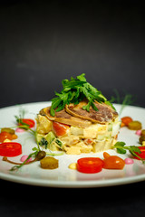 salad with meat and ingredients on a white plate