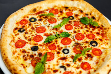 hot italian pizza with cheese and basil, isolated