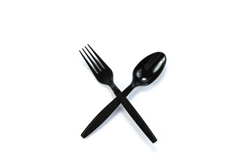 black plastic spoon and fork isolated on white background