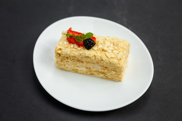 a slice of honey cake with berries, sweet dessert