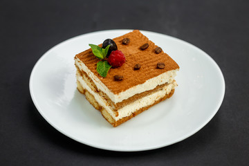 sweet coffee cheesecake with berries, mint and coffee beans, dessert