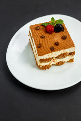 sweet coffee cheesecake with berries, mint and coffee beans, dessert