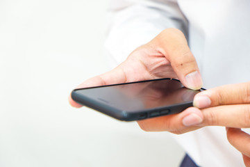 Business man hand use smartphone on white background close up on hand