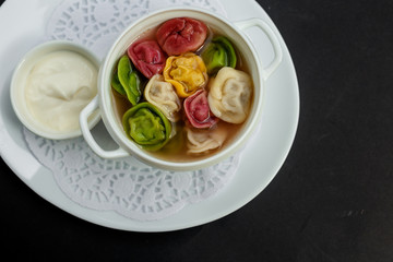 children's colored dumplings, dough made from beets, spinach and carrots by hand kneading and meat beef filling
