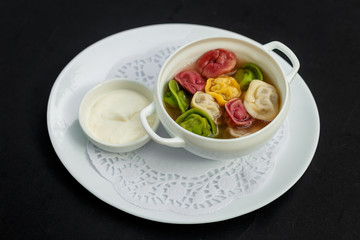 children's colored dumplings, dough made from beets, spinach and carrots by hand kneading and meat beef filling