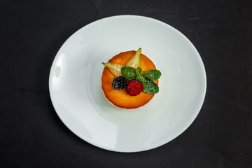 delicious cheesecake with raspberry flavor with berries, powdered sugar and mint, dessert