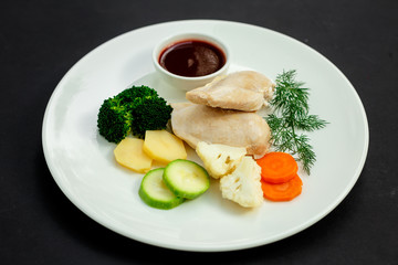 boiled chicken breast with vegetables and sauce, healthy food