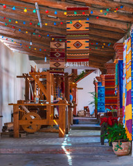 Full shot of a colorful rug workshop