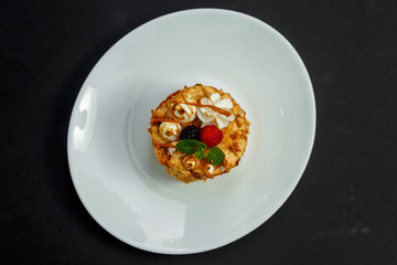 sweet cheesecake with honey caramel, berries and mint, dessert