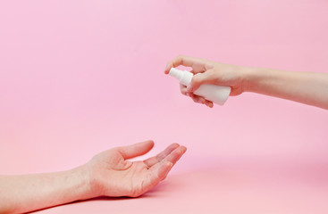 Hand sanitizer gel for hand hygiene corona virus protection. Female hands with liquid sanitizer. Top horizontal view copyspace