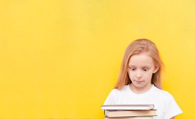 Little girl in  surgical medical mask isolated on blue background. Virus protection concept. Top horizontal view