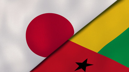 The flags of Japan and Guinea Bissau. News, reportage, business background. 3d illustration