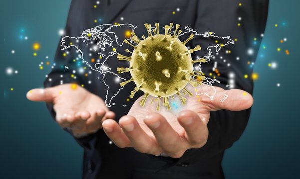 Businessman hands holding virus molecule in palms