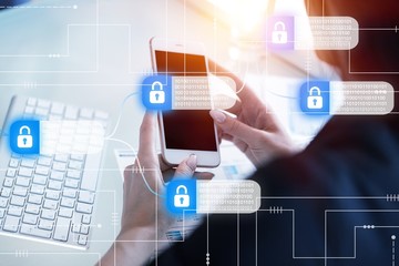 Hacker attack and data breach, information concept. Human hands with smartphone