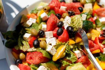 Greek salad with olives and olives, with feta cheese and tomatoes