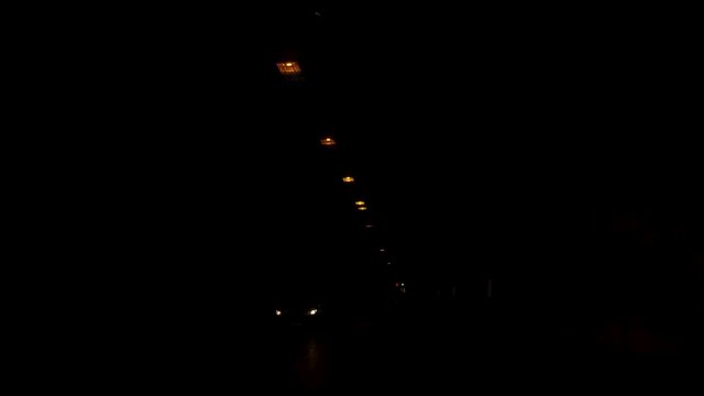 Dolly Tracking Pov Front Shot View Of Driving and entering a dark tunnel