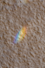 Rainbow reflection on cracked plaster Texture for overlay