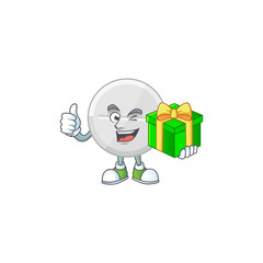 Naklejka na ściany i meble Smiley white pills cartoon character holding a gift box