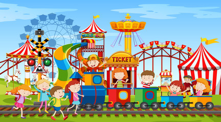 Themepark scene with many rides and happy children