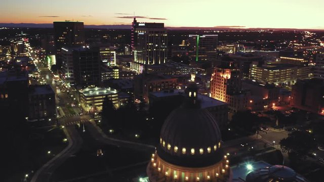 Aerial flying over Idaho State Capitol Building and downtown Boise at night. Boise, Idaho, USA. 5 October 2019