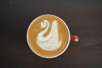 Latte art Coffee on table at cafe