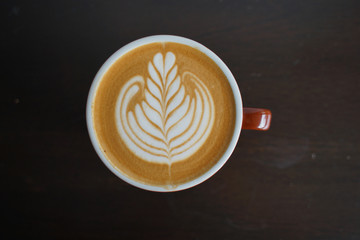 Latte art Coffee on table at cafe