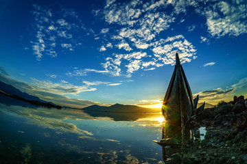 Traditional Boat and location fisherman on the beach at sunrise time, Hon Thien village, Phan Rang, Vietnam