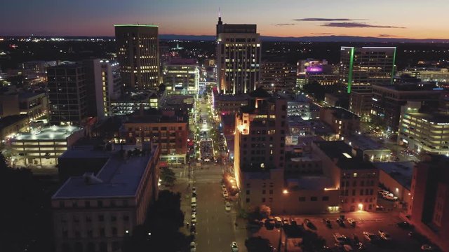 Aerial flying over downtown Boise at night. Boise, Idaho, USA. 