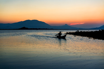 Obraz premium Traditional Boat and location fisherman on the beach at sunrise time, Hon Thien village, Phan Rang, Vietnam
