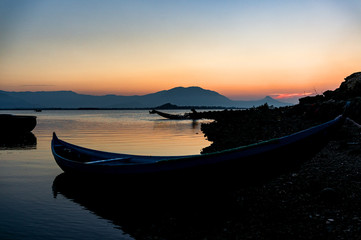 Traditional Boat and location fisherman on the beach at sunrise time, Hon Thien village, Phan Rang, Vietnam
